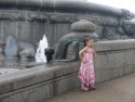 A little girl next to a snake on the Gefion Fountain